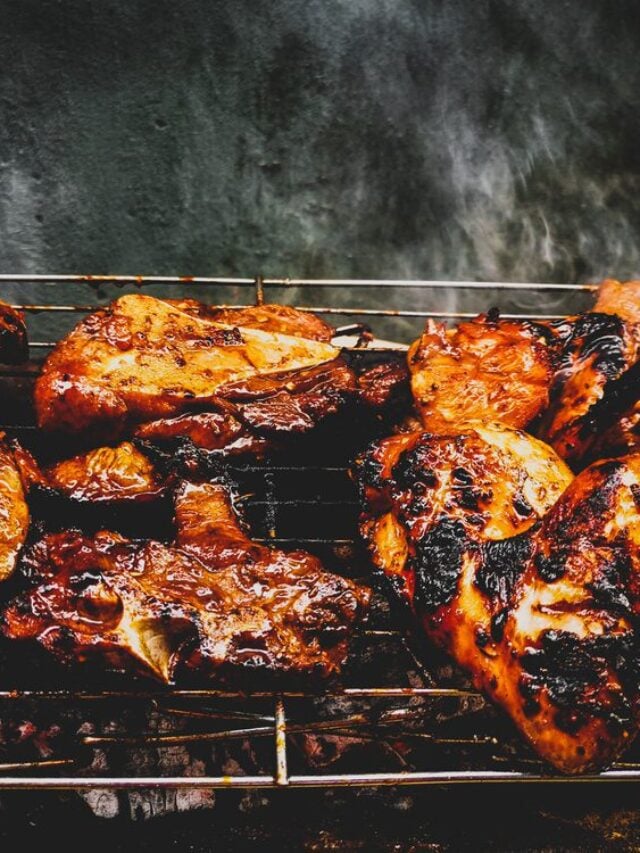 Delicious chicken wings and lamb barbecue on hot grill