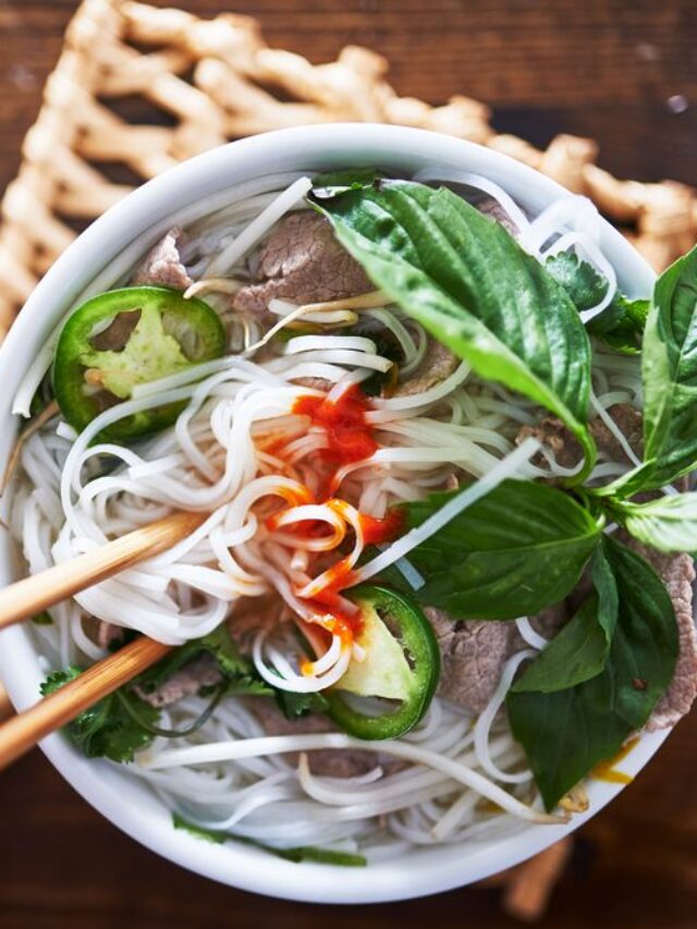 vietnamese pho with spicy sriracha sauce shot top down