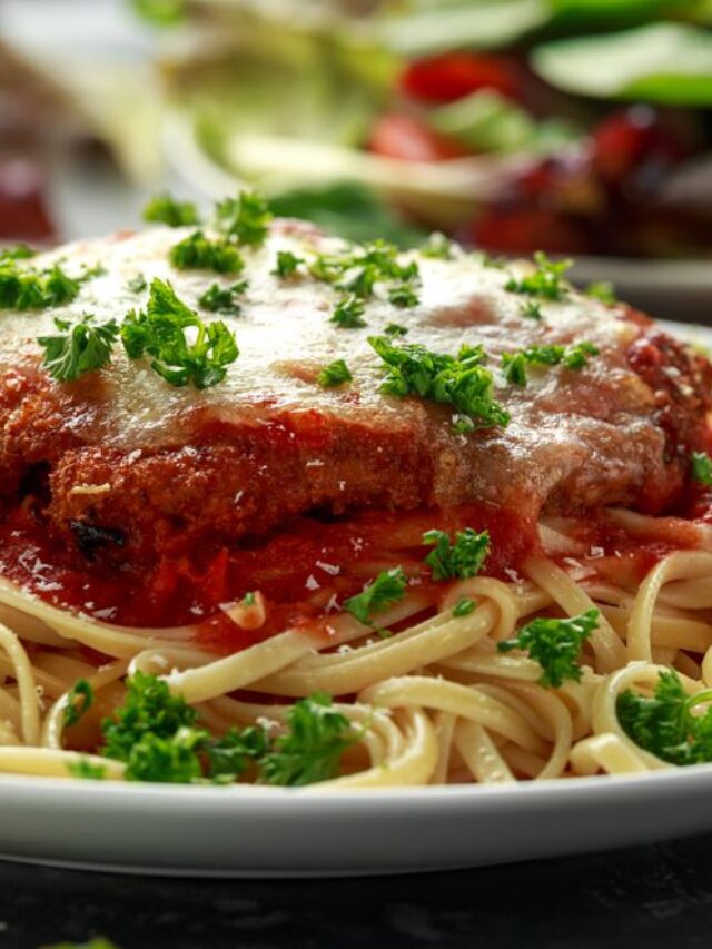 Chicken Parmesan with Cheese and Marinara Sauce served over spaghetti, pasta