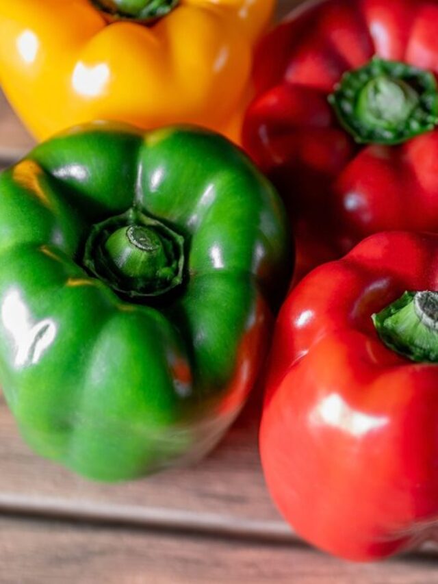 Colorful bell pepper on a wood boards