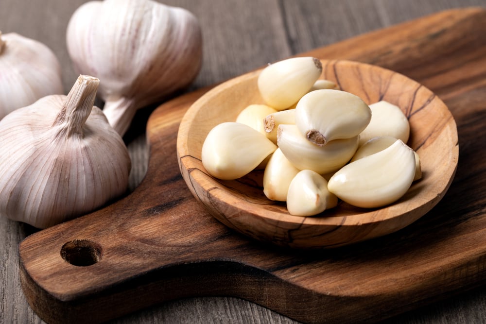 Why You Shouldn't Peel Your Garlic When You Use a Garlic Press